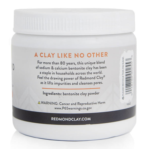 White jar of Redmond Clay displaying ingredient list and company branding. 
