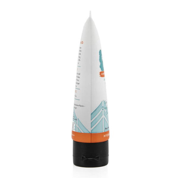 A white and teal tube of Spa Find Deep Sea Hydrating Mud Mask stands against a plain white background. 
