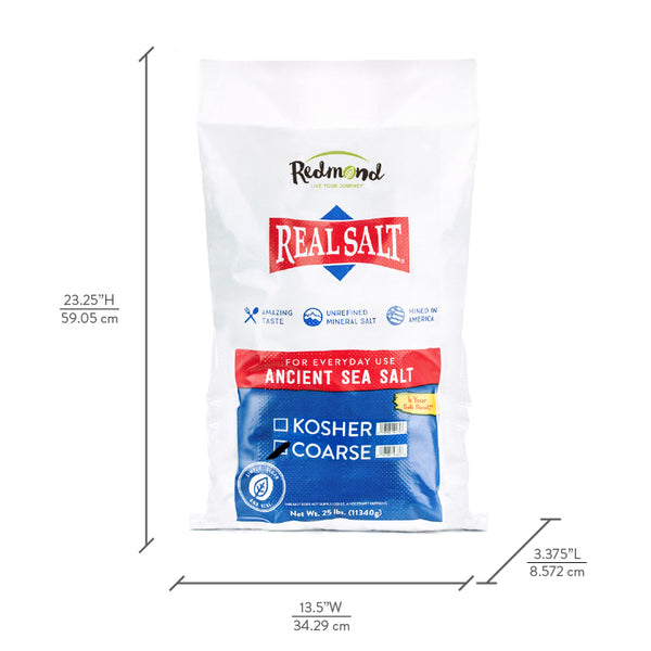 Redmond Real Salt brand ancient sea salt in a 25-pound bag. The bag is white with red and blue branding and text that reads "Real Salt, Ancient Sea Salt, Kosher, Coarse." 
