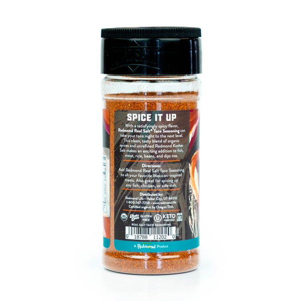 Redmond Real Salt® Taco Seasoning jar displays its back label, highlighting the product's organic ingredients and use for Mexican-inspired dishes. 
