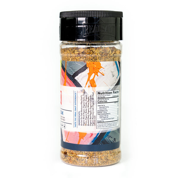 Clear glass jar of Real Salt steak seasoning displaying the nutritional facts label. 
