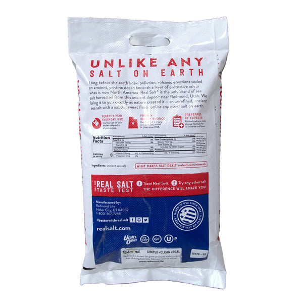 White bag of Redmond Real Salt, showcasing the nutritional information and highlighting its origin from a pristine ancient seabed in Utah. 
